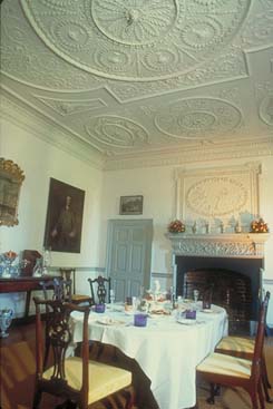 Dining room at Kenmore showing elaborate plaster ceilings and fireplace.